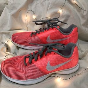 Pink and grey Nike tennis shoes